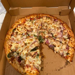 a pizza in a cardboard box