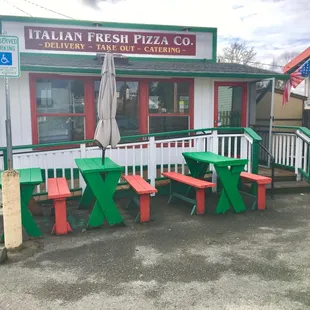 Outdoor benches and parking out front