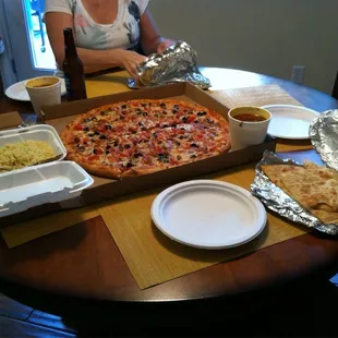 How our dinner was set up with the italian combo pizza, the chicken curry and naan