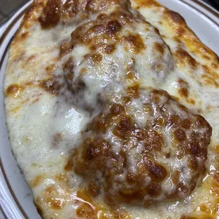 a cheese and meatball pizza