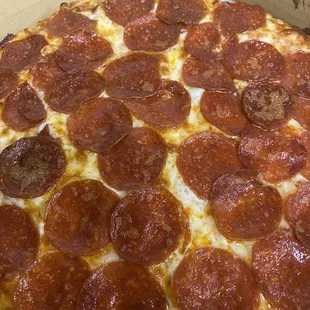 a pepperoni pizza in a box