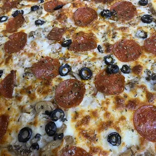 a pepperoni and olive pizza