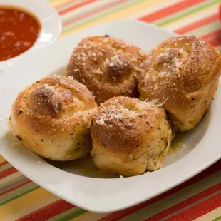 a plate of bread rolls