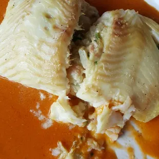 Sole stuffed with crab and shrimp on lobster sauce