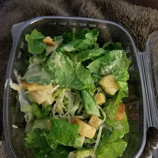 a salad in a plastic container
