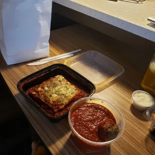 a meal of lasagna and sauce