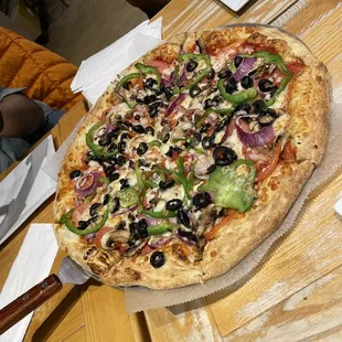 a pizza on a wooden table