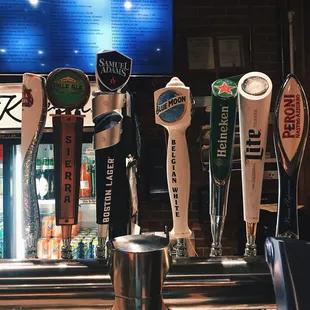 a row of beer taps