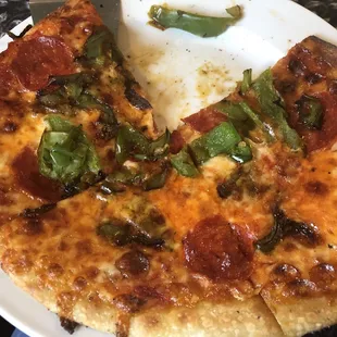 Pizza with pepperoni and what were supposed to be mild peppers..were presented as mild peppers..but I&apos;m pretty sure were green peppers..