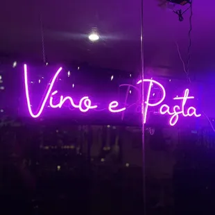 Neon sign saying what they serve!!