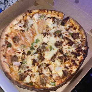 Cajun Pizza - half of a small and burnt. Clearly loaded into the oven this way.