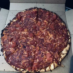 This is a margarita pizza?   It's literally burned crust with canned crushed tomatoes on top.  1/10.  Enough said.  A picture says it all.