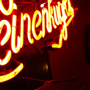 Neon beer signs flavor the atmosphere.