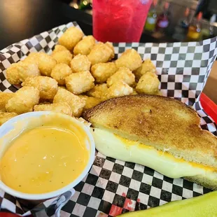 Cheese on cheese! Grilled cheese and tots with beer cheese!