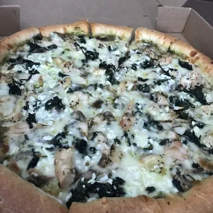 Pesto Pizza hand-tossed thick crust, chicken breast, Feta cheese, mushroom, spinach