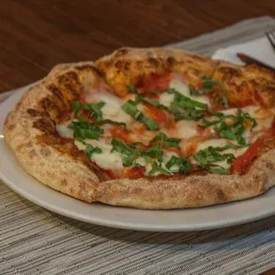 a pizza on a white plate
