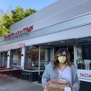 Standing outside after doing contact-free pickup