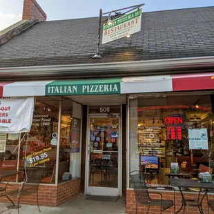 Outside. Storefront. Entrance. We parked on the street to pick up. 30-minute spots. Did not appear parking payment was required.