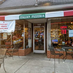 Outside. Storefront. Entrance. We parked on the street to pick up. 30-minute spots. Did not appear parking payment was required.