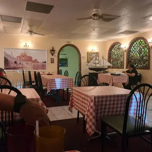 a dining area with tables and chairs