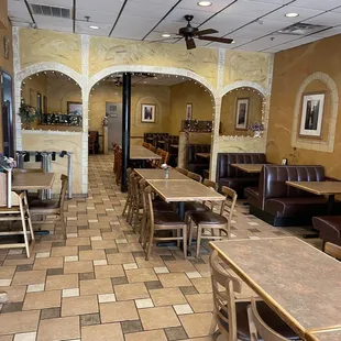 a dining area with tables and chairs