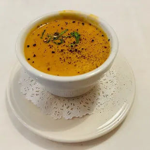 a bowl of soup on a plate