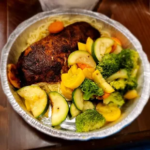 Blackened Snapper with Florentine sauce and vegetables on a bed of angel hair pasta...