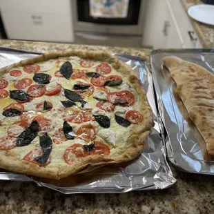 Large Cheese Calzone and a 22 inch Bianca Pizza with  and basil