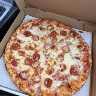 a pepperoni pizza in a box