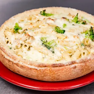 a baked pizza on a red plate