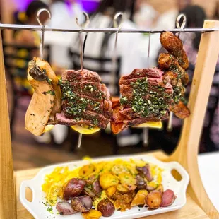 a platter of meat and potatoes