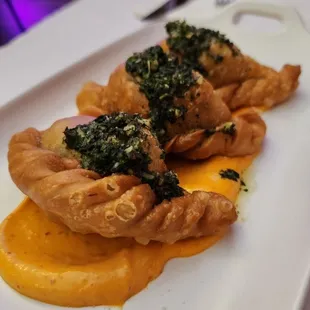 Short Rib Empanadas topped with Chimichurri