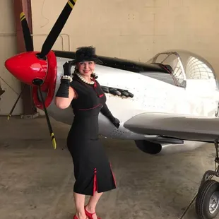 A beautifully accessorized rendition of our 30's Bombshell in black and Red for a vintage event.