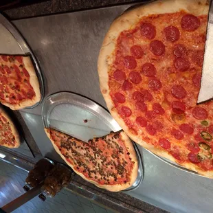 pepperoni, olives, and cheese pizzas