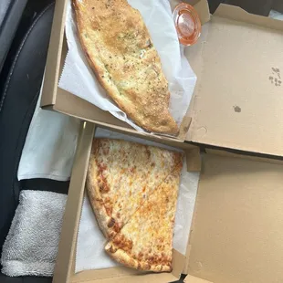 Calzone (chicken &amp; broccoli)  and a couple of the best pizza slices in Orlando.