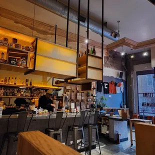 a view of a bar with stools