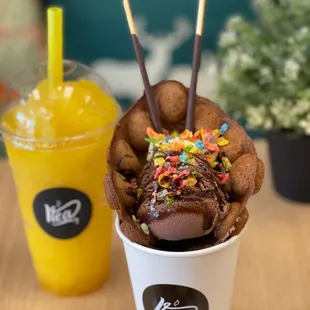 a cup of ice cream with sprinkles