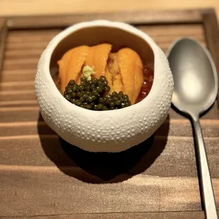 marinated ikura (salmon roe), golden osetra caviar, and Hokkaido uni atop rice