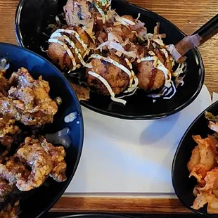 three bowls of food on a tray