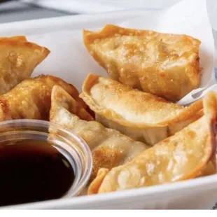 a close up of a bowl of dumplings