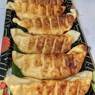 a plate of ramen sushi