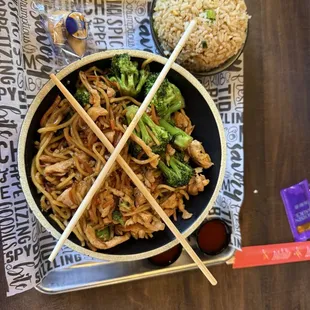Fried rice, chicken, garlic butter noodles, broccoli, and carrots