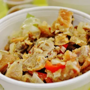 Sisig...a little different than I&apos;ve had. This was a bit more soupy on the bottom, versus a more dried consistency. Good though!