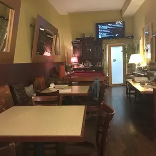 a restaurant with tables and chairs