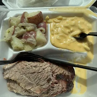 Brisket plate with sides of German Potatoes and Mac and Cheese.