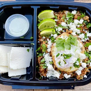 Spanish Phly Fried Rice w/ our signature spicy green sauce and a side of queso fresco