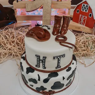 a birthday cake with a cowboy theme