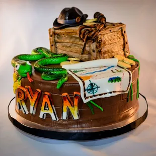 If adventure has a name, it must be Indiana Jones! (or Ryan). This custom cake features several (fully edible) decorations!