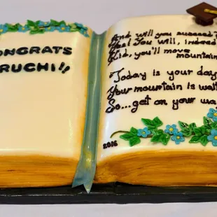 Life is an open book. This cake is vanilla with strawberry filling on one side and chocolate with chocolate hazelnut mousse on the other.