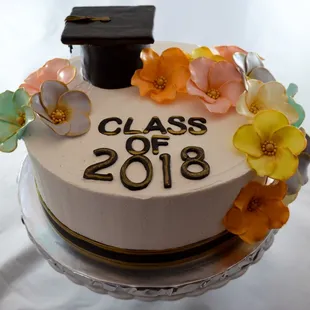 Order this flower themed graduation cake to brighten up your special celebration! All decorations are edible!